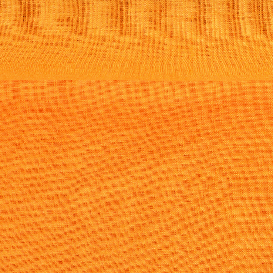 Washed linen fabric in orange colour, 205 g/m²